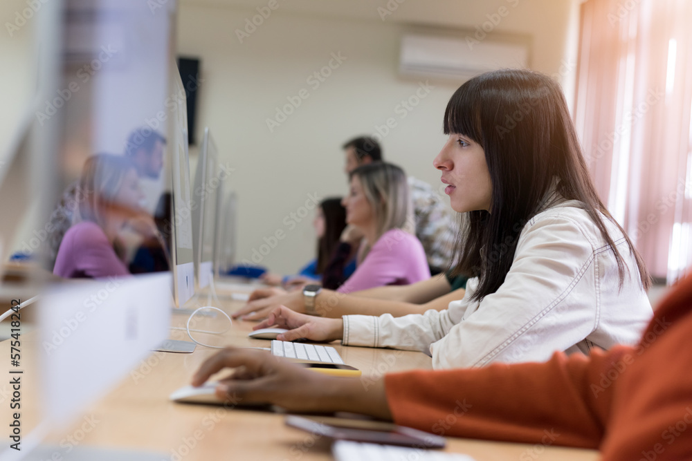 Young people in programming school.Students Learning In A Programing Class Young people in programming school.Students Learning In A Programing Class