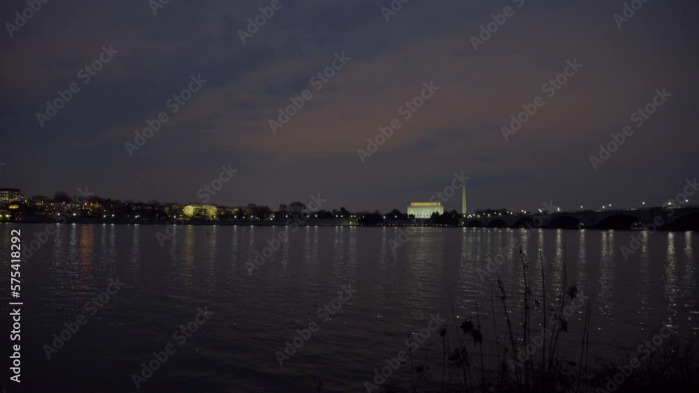 Lockdown Shot Of Famous Monuments In Illuminated City Against Clear Sky During Night - Washington, District of Columbia Lockdown Shot Of Famous Monuments In Illuminated City Against Clear Sky During Night - Washington, District of Columbia