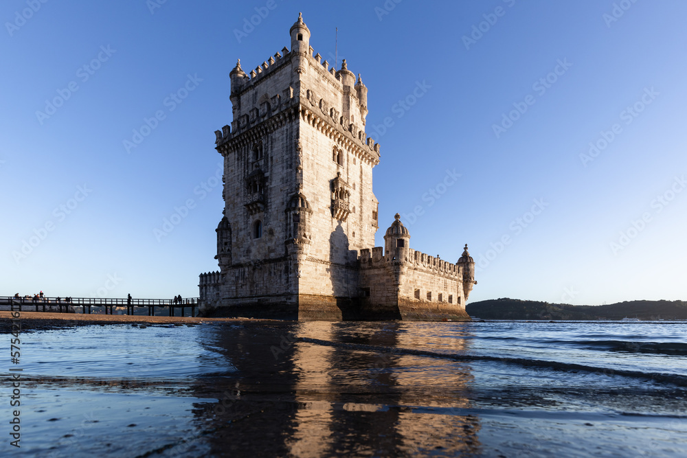 Torre de Belém on the banks of the Tagus, historic watchtower in the sunset. Old Town Lisbon, Portugal, people empty
