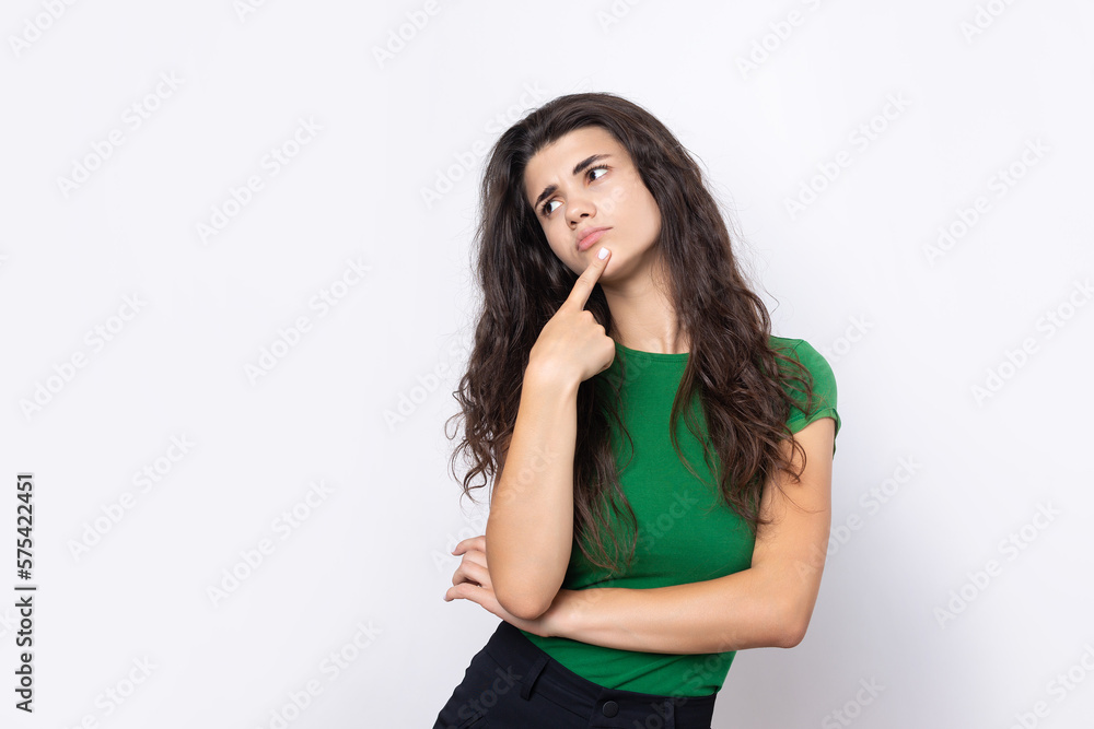 Portrait of a beautiful young woman thinking, isolated on white background Portrait of a beautiful young woman thinking, isolated on white background