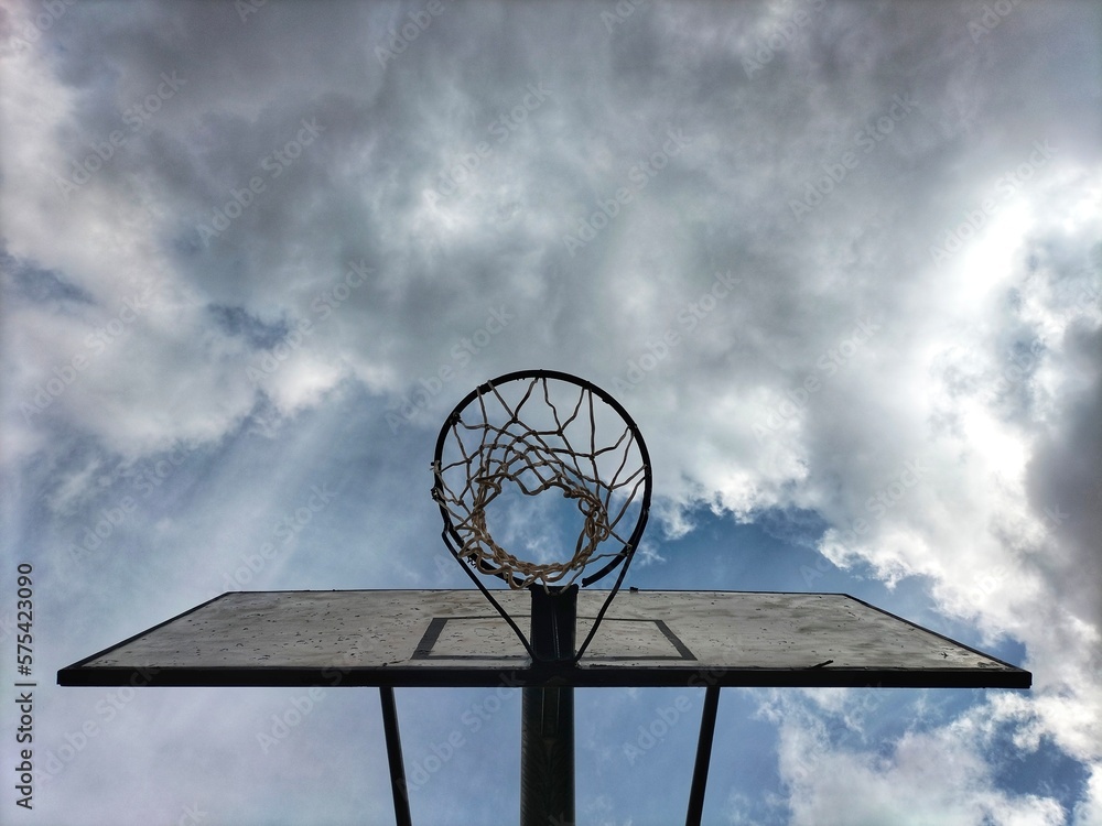 basketball hoop against blue sky basketball hoop against blue sky