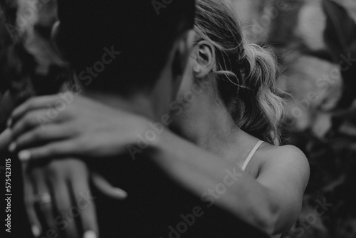 wedding details essentials white wedding dress bride in white robe getting ready for wedding day rings sandals heels sea sunset seaside 