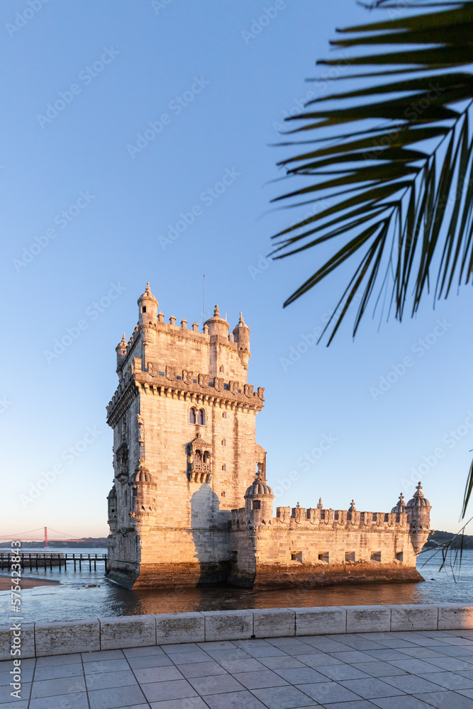 Torre de Belém on the banks of the Tagus, historic watchtower in the sunset. Old Town Lisbon, Portugal, people empty