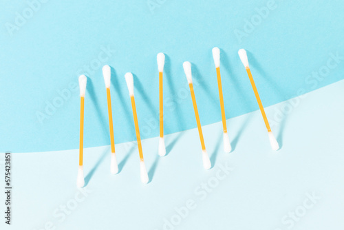 Cotton swabs on a blue background. Top view.