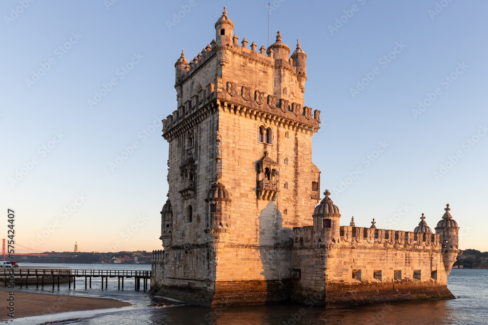 Torre de Belém on the banks of the Tagus, historic watchtower in the sunset. Old Town Lisbon, Portugal, people empty