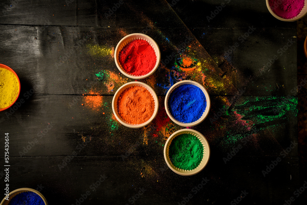 Colorful traditional holi powder in bowls. Happy holi. Concept