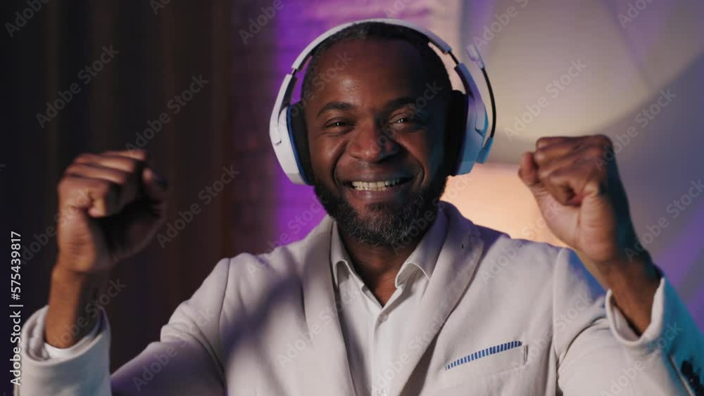 DJ Plays Music at Home Party. Black African American Guy Mixing Tracks Smiles And Have Fun. Close up shot DJ Plays Music at Home Party. Black African American Guy Mixing Tracks Smiles And Have Fun. Close up shot