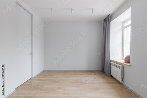 Empty gray room ready for people to move in