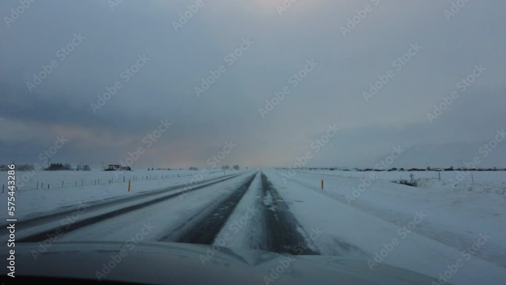 Driving in Iceland under a Soft Pink Sky on the Ring Road in Southern Iceland Driving in Iceland under a Soft Pink Sky on the Ring Road in Southern Iceland