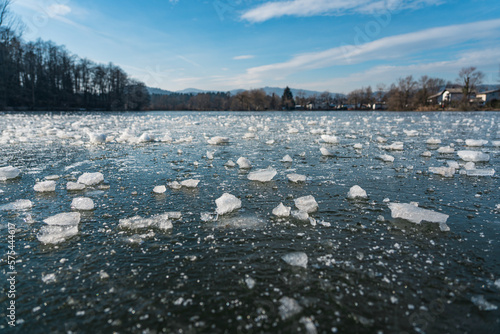 Pieces of ice cubes on a frozen pond in the middle of the city, Ljubljana photo