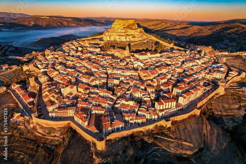 Εκτύπωση καμβά Aerial view at sunrise above the beautiful village of Morella in the mountains o