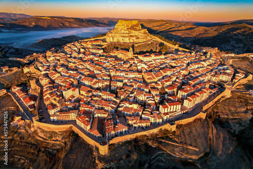 Aerial view at sunrise above the beautiful village of Morella in the mountains of Castell  n