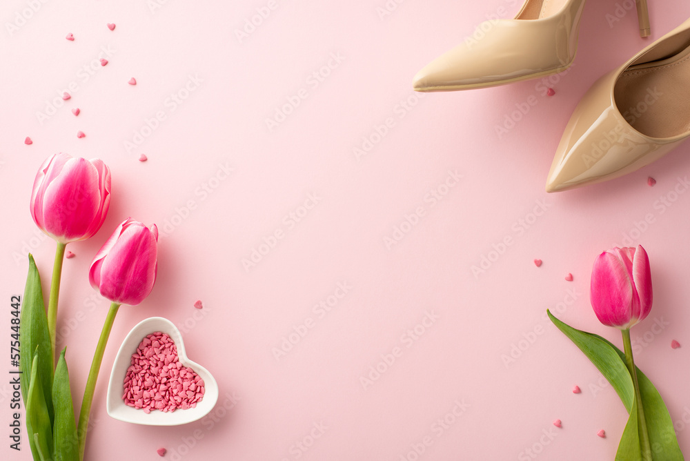 8-march concept. Top view photo of pink tulips beige high heel shoes and sprinkles on isolated pastel pink background with empty space