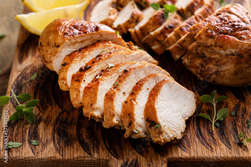 Fotografija Grilled or roasted chicken breast on a serving plate