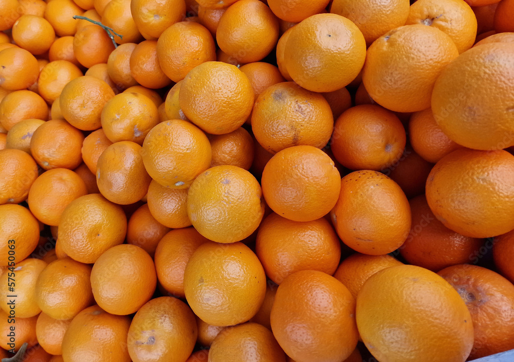 fruit background of ripe healthy oranges at the market stall fruit background of ripe healthy oranges at the market stall