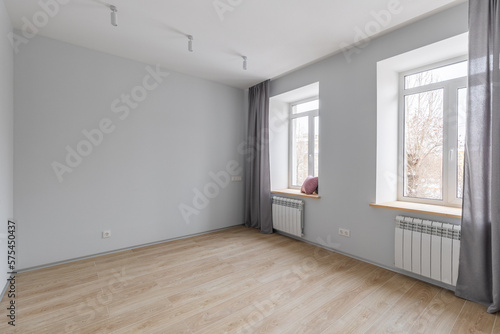 Empty gray room ready for people to move in