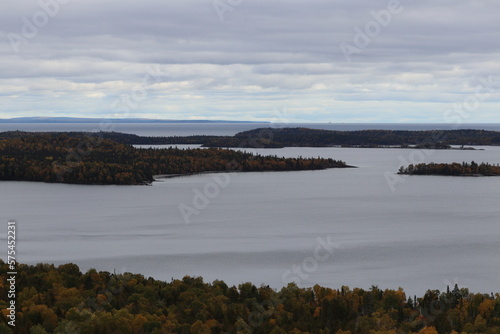 View of Lake Superior rocks and beach with autumn trees in Grand Marais, in Northern Minnesota  © Jessica Brouillette
