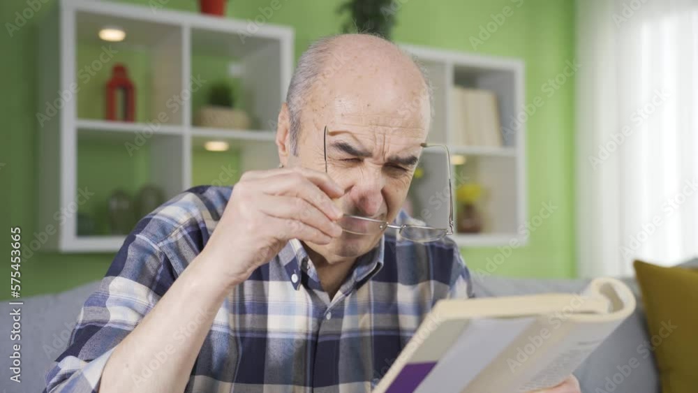 Elderly man with eye disorder wears glasses while reading a book.
Old man with visual impairment has vision problems and wears glasses while reading a book at home.
Elderly man with eye disorder wears glasses while reading a book.
Old man with visual impairment has vision problems and wears glasses while reading a book at home.