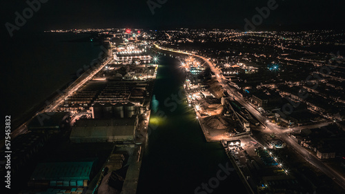 Aerial view of an industrial estate and port with warehouse at night