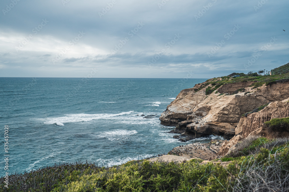 Standing on cliff overlooking looking the ocean on a cloudy day - Pacific Ocean - San Diego Cliffs Standing on cliff overlooking looking the ocean on a cloudy day - Pacific Ocean - San Diego Cliffs