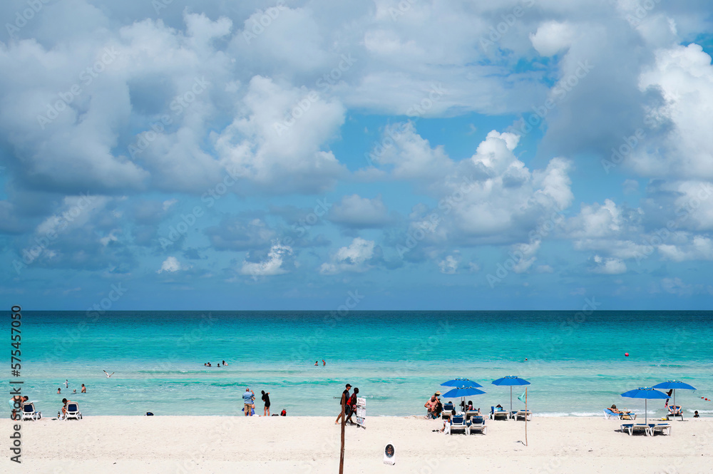 Varadero beach in Cuba in the year 2023. Blue sea, clear sky and many tourists on the beach. Varadero beach in Cuba in the year 2023. Blue sea, clear sky and many tourists on the beach.