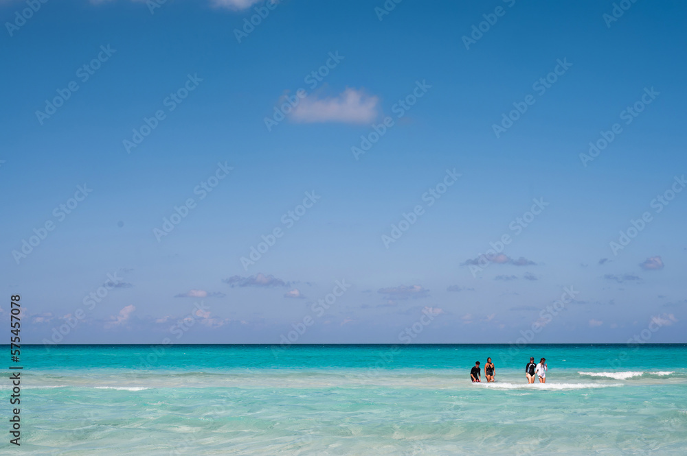 Varadero beach in Cuba in the year 2023. Blue sea, clear sky and many tourists on the beach. Varadero beach in Cuba in the year 2023. Blue sea, clear sky and many tourists on the beach.