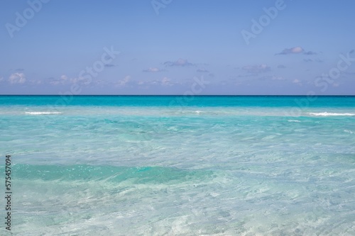 Varadero beach in Cuba in the year 2023. Blue sea, clear sky and many tourists on the beach.