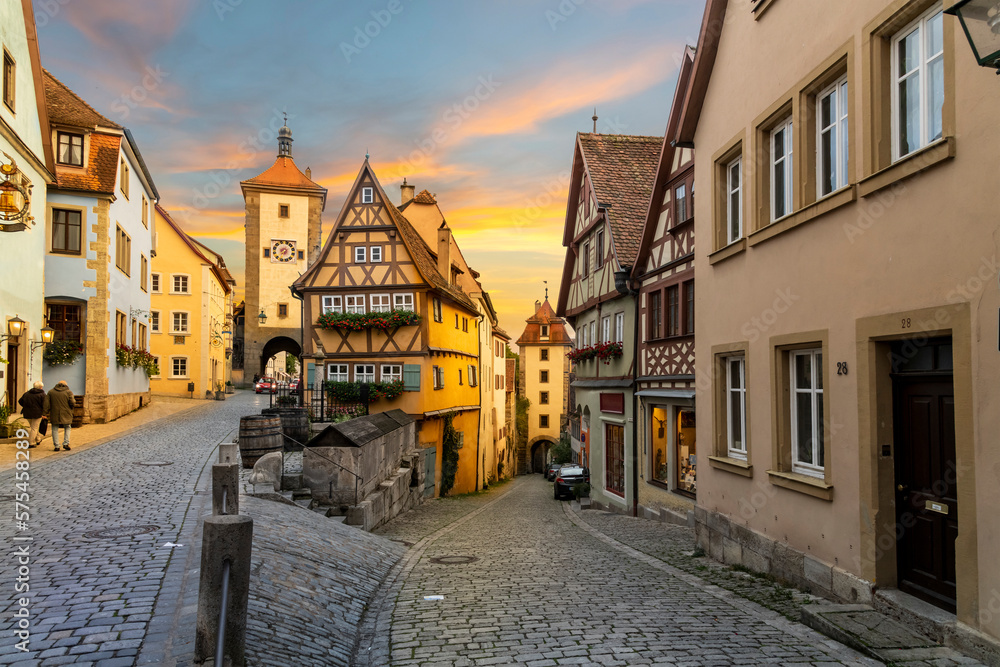 Sunset view of the picturesque Plönlein, or Little Square, a famous split in the road in the Bavarian village of Rothenburg ob der Tauber, Germany.