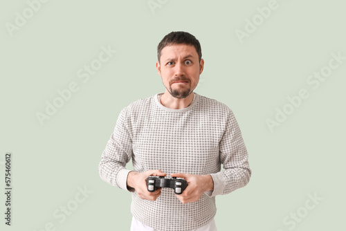 Handsome man with game pad ...