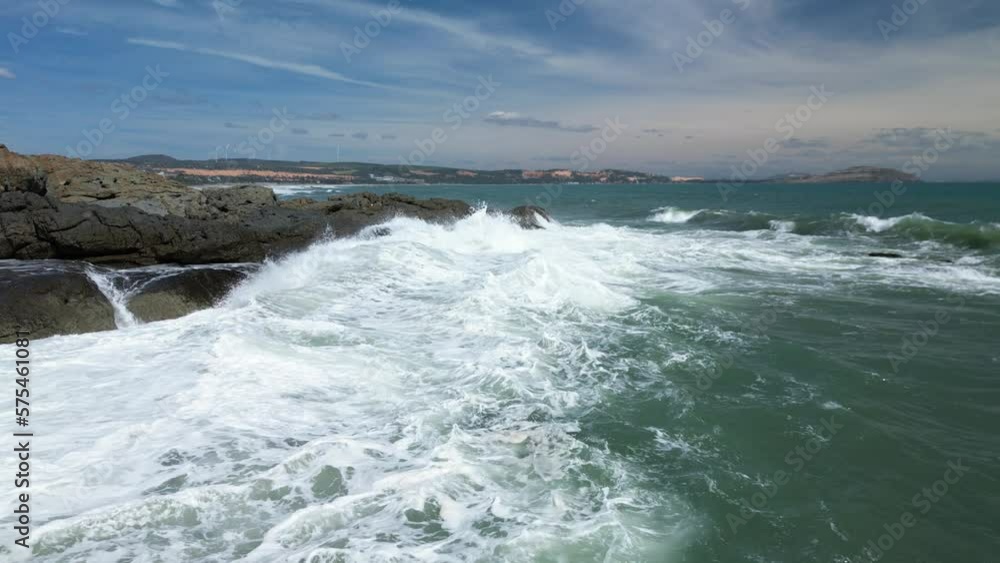 Ocean Waves Crashing Against Rocks And Cliffs. Vietnam, Asia. Large Ocean Beautiful Wave, Extreme wave crushing coast, Big ocean Beautiful wave, Amazing wave force breaking through dangerous rocks. 4K Ocean Waves Crashing Against Rocks And Cliffs. Vietnam, Asia. Large Ocean Beautiful Wave, Extreme wave crushing coast, Big ocean Beautiful wave, Amazing wave force breaking through dangerous rocks. 4K