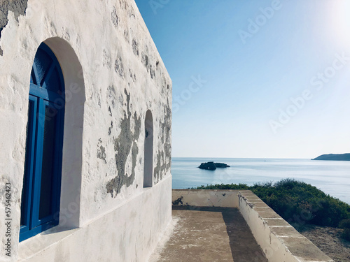 All blue skies and seas on a bright Summer's day outside the small church on top of the hill at the port of Psathi, Kimolos island, Greece.