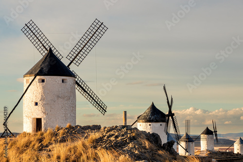 Traditional windmill on a mountain at sunset of Consuegra, Toledo province, Castilla la Mancha, Spain photo