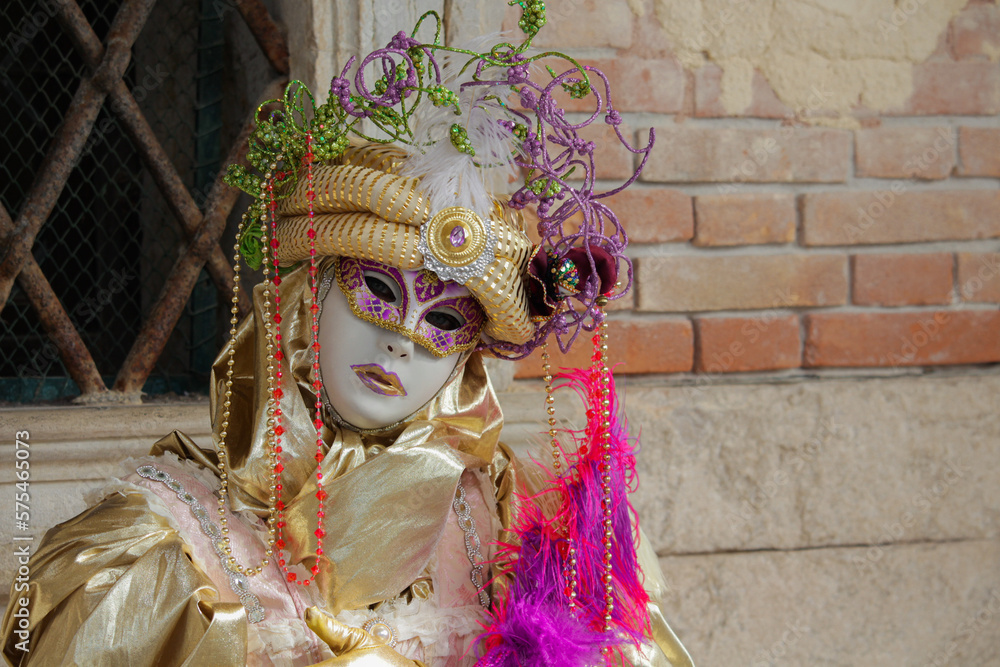 City carnival mask, venetian carnival masks in gold costumes, traditional carnival in Venice, Italy.