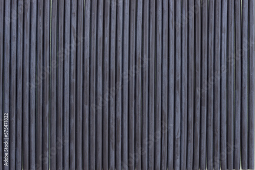 background or wallpaper composed of many synthetic black straws or thin, hollow tube made of black plastic