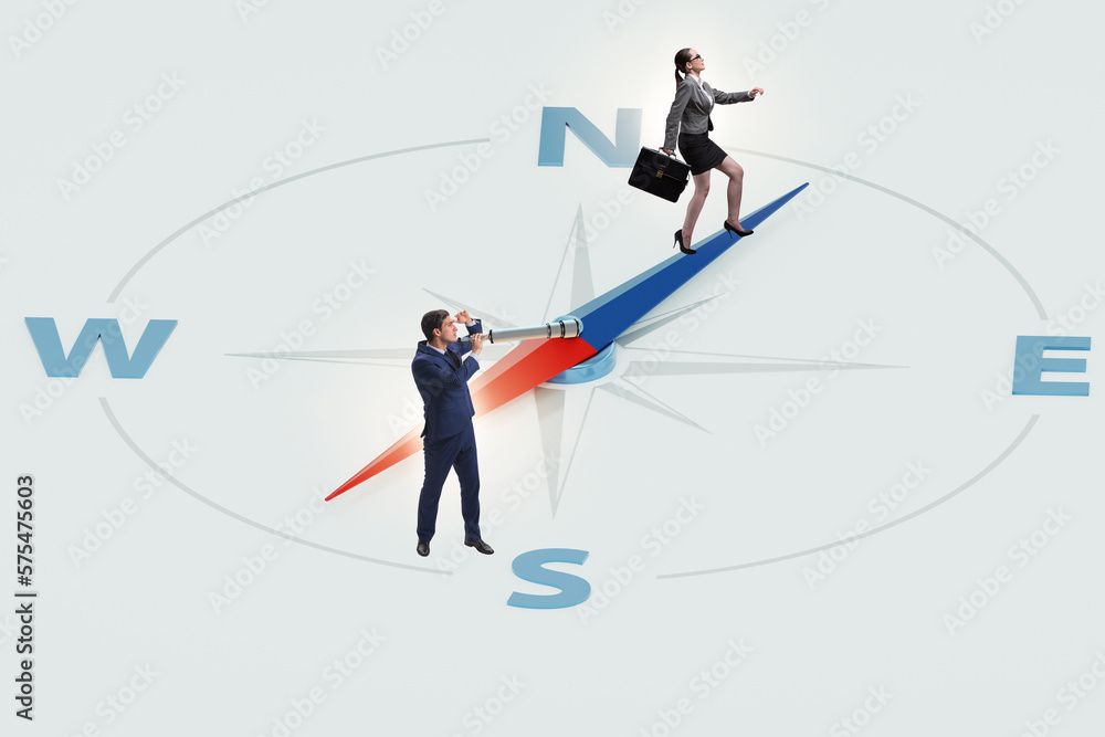 Business people with compass looking for direction Business people with compass looking for direction