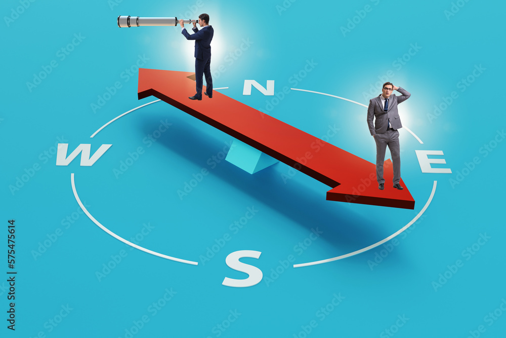 Businessman with compass looking for direction Businessman with compass looking for direction