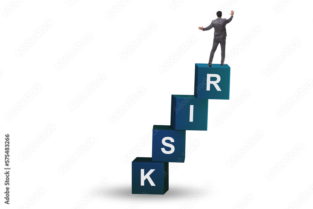 Risk management concept with businessman on cubes Risk management concept with businessman on cubes