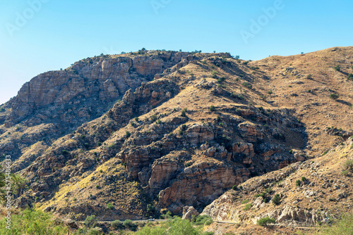 Rolling mountain hills with road and transportation in the cliffs and ridges of wild west great outdoors arizona © Aaron