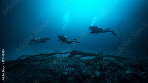 Wallpaper Mural three technical divers diving above a halocline in Angelita cenote Torontodigital.ca