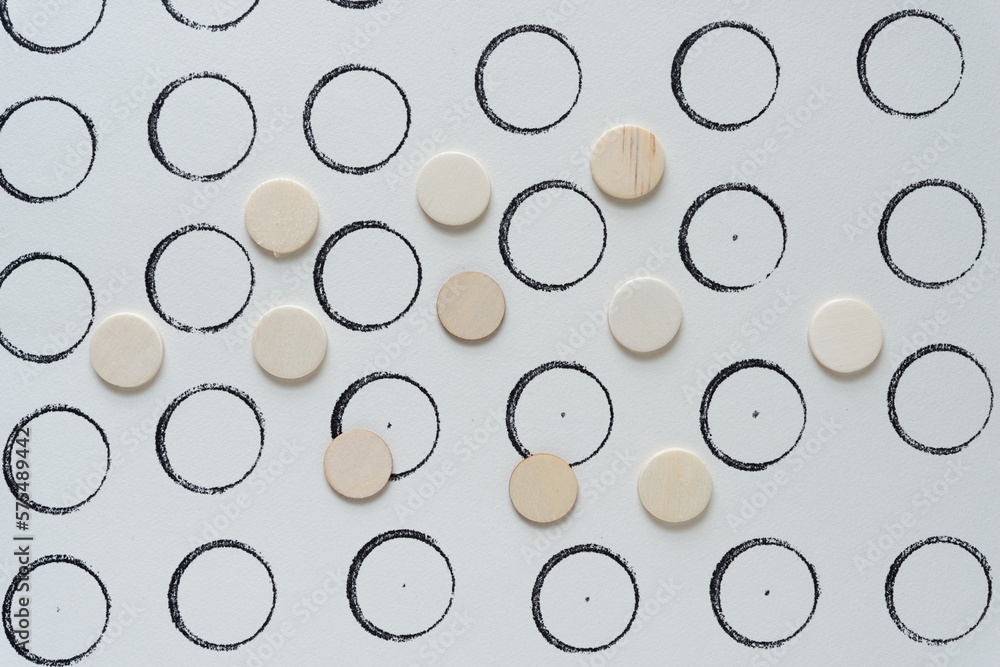 wooden dots on paper with ink stamp circles