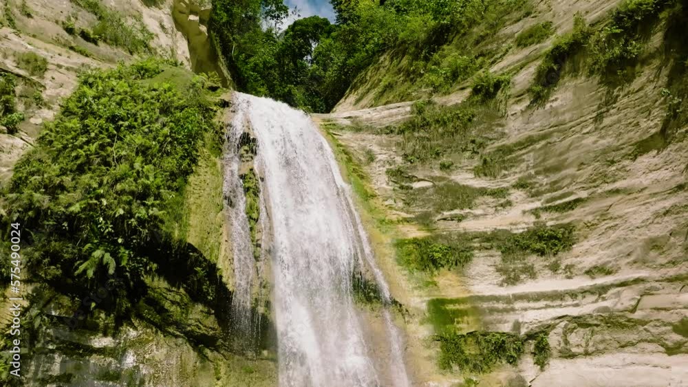 A beautiful waterfall among the rainforest and vegetation in slow motion. Dao Falls. Cebu, Philippines. A beautiful waterfall among the rainforest and vegetation in slow motion. Dao Falls. Cebu, Philippines.