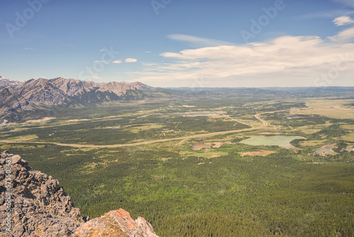 Landscape of the Alberta Prairie's from the top of Yates Mountain with a Rocky cliff in the foreground