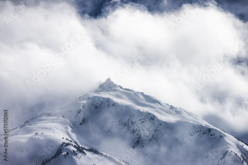 Snow and Cloud covered Canadian Nature Mountain Landscape Background. Winter Season in Whistler, British Columbia, Canada.