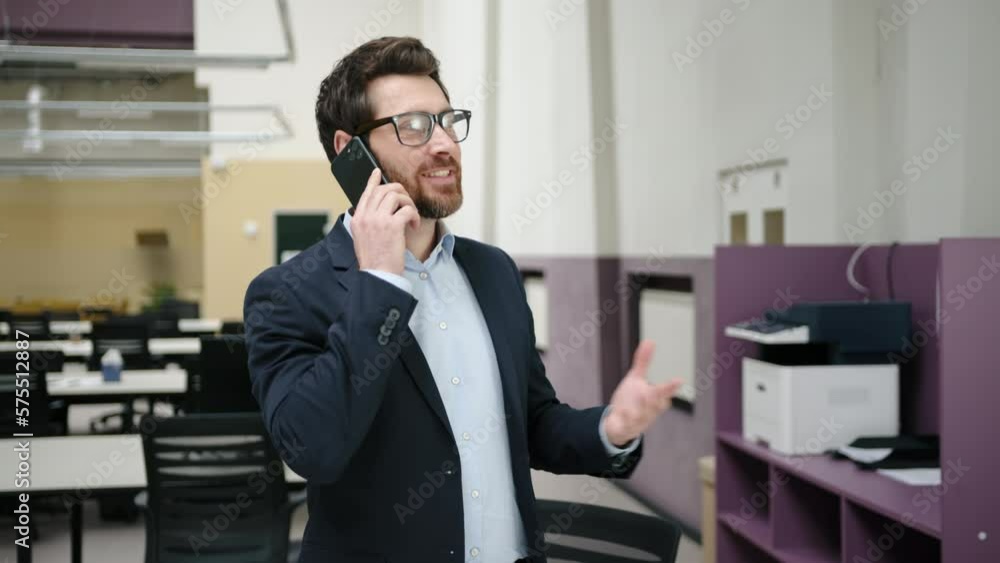 Close-up view of a confident businessman using a smartphone and talking. Portrait of caucasian man in glasses and formal suit having a business call. High quality 4k footage Close-up view of a confident businessman using a smartphone and talking. Portrait of caucasian man in glasses and formal suit having a business call. High quality 4k footage