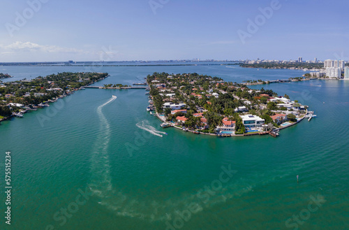 Miami Florida landscape with aerial view of the man made Intracoastal Waterway. Boat and houses built in the middle of the water can be seen under the blue sky. photo