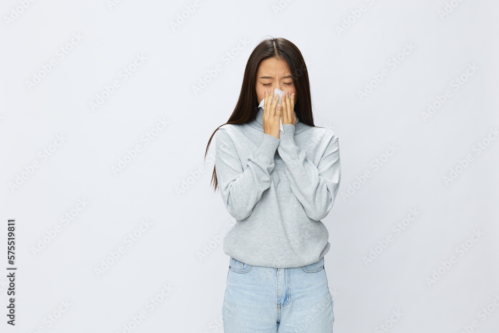 Asian woman holding hand with handkerchief and coughing up flu and cold, stuffy nose viral disease asthma and allergies covid 19 white background Asian woman holding hand with handkerchief and coughing up flu and cold, stuffy nose viral disease asthma and allergies covid 19 white background