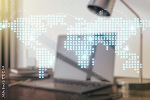 Abstract creative world map with connections on modern laptop background, international trading concept. Multiexposure © Pixels Hunter