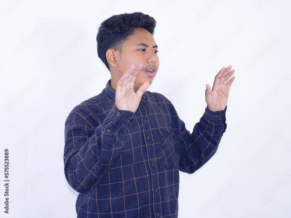 Wow and surprised face of young Asian with open hand gesture. Advertising model concept on white background Wow and surprised face of young Asian with open hand gesture. Advertising model concept on white background