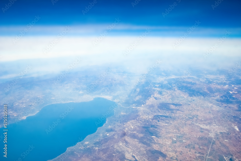 Beautiful earth and sea from a window airplane background