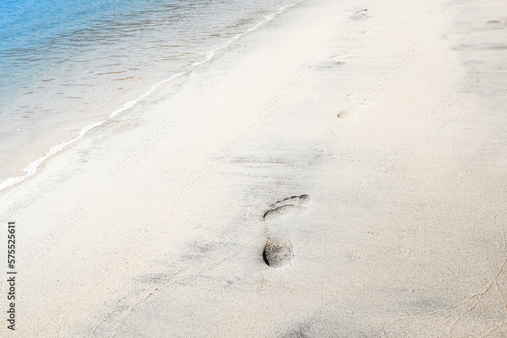 Beautiful footprints on the beach in nature by the sea Beautiful footprints on the beach in nature by the sea